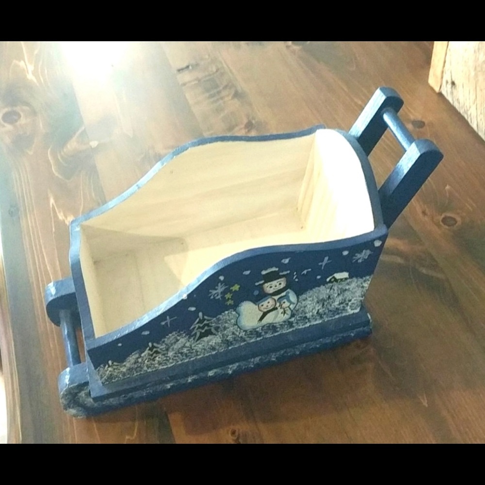 Handmade Winter or Christmas decoration sleigh wooden and painted with snowmen.